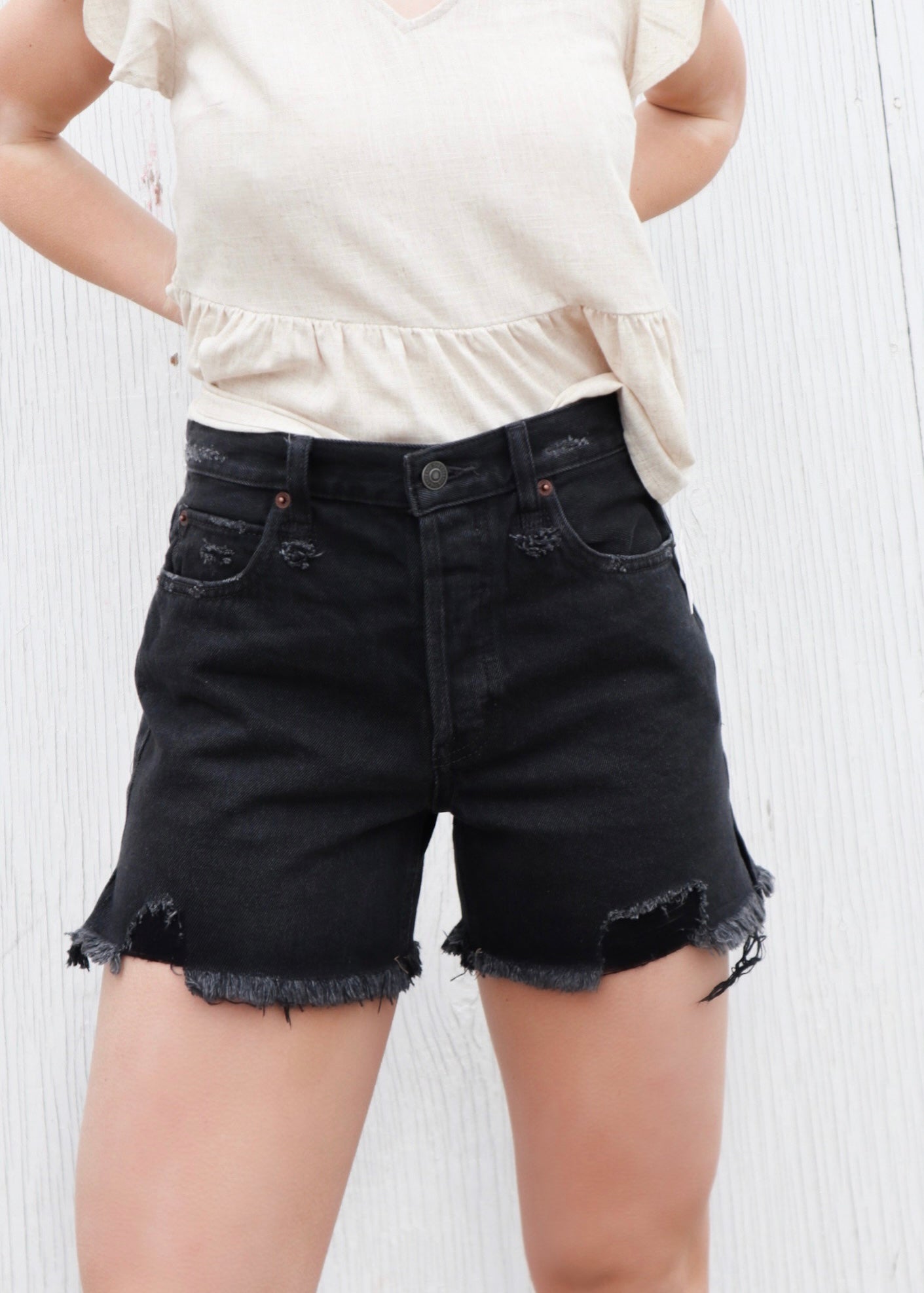 Free People Makai Cutoff Shorts – High-waisted denim shorts with a frayed hem, offering a relaxed fit and a vintage-inspired style for a casual, laid-back look, Washed Black