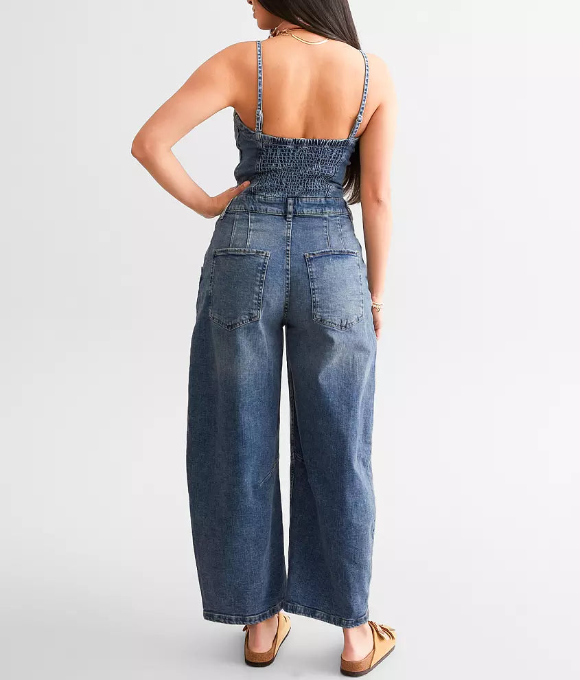 Free People Je Suis Prêt Denim Barrel Jumpsuit – a slim-fit jumpsuit with a corset-inspired bodice, tapered barrel leg, removable straps, five-pocket design, and smocking at the back, Petit Blue
