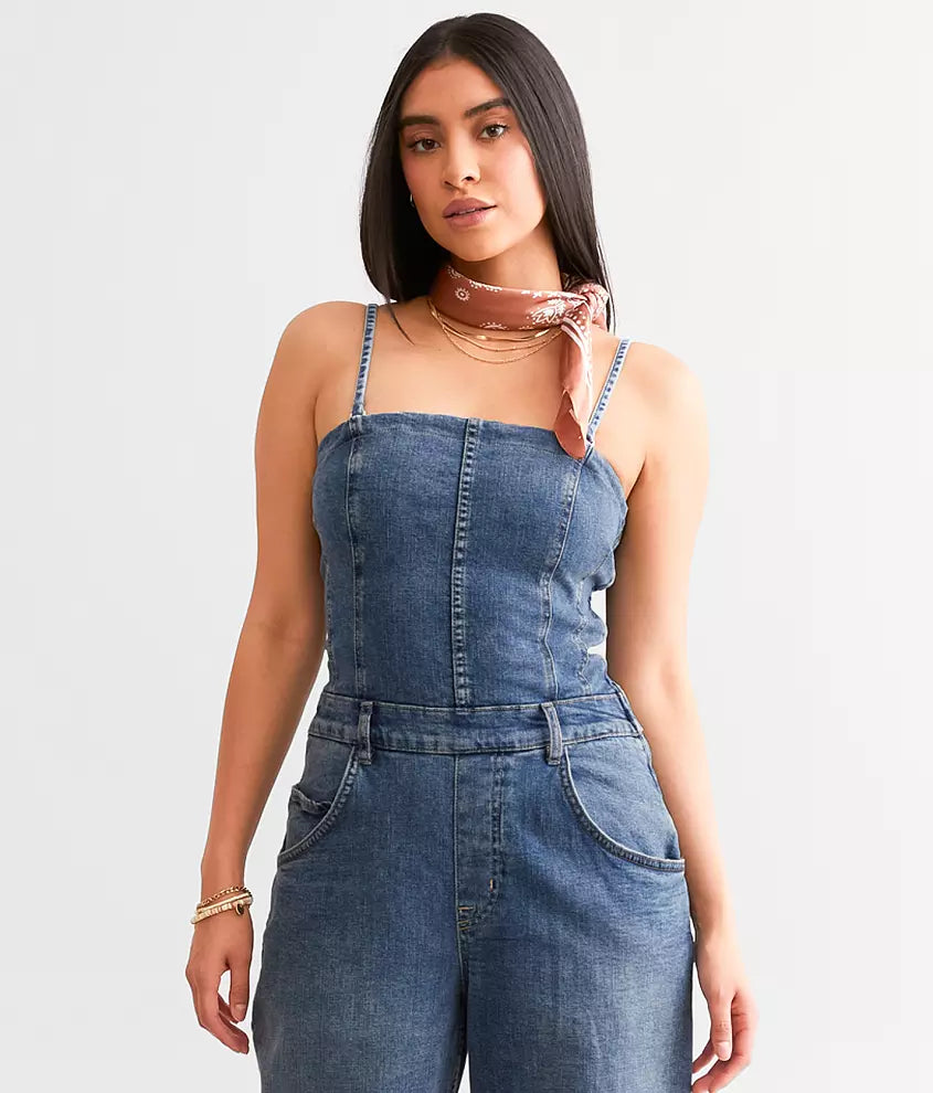 Free People Je Suis Prêt Denim Barrel Jumpsuit – a slim-fit jumpsuit with a corset-inspired bodice, tapered barrel leg, removable straps, five-pocket design, and smocking at the back, Petit Blue
