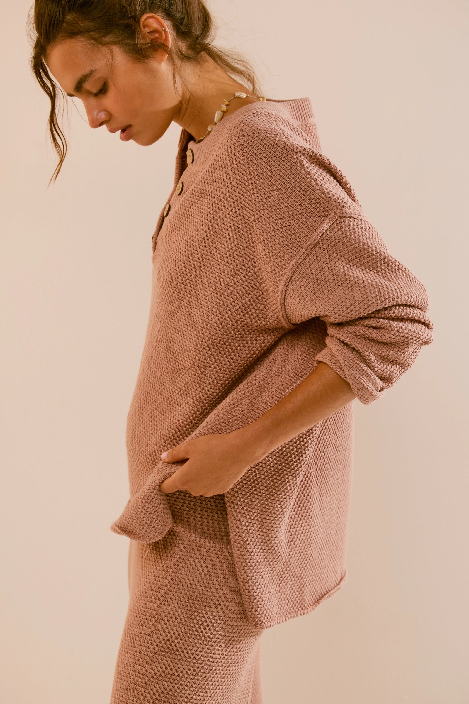 Free People Hailee Sweater Set featuring a soft, ribbed knit long-sleeve sweater and matching high-waisted, wide-leg pants. The relaxed fit of both pieces offers a comfortable and stylish look, perfect for lounging or casual outings, Tuscany