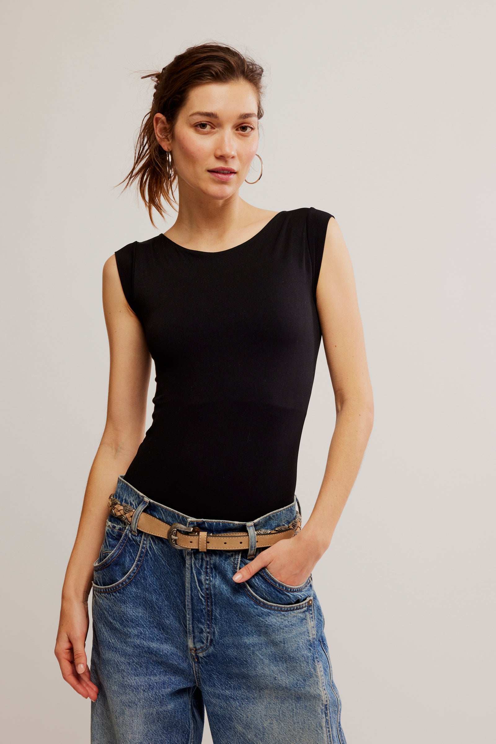 Free People Clean Line Boatneck Bodysuit with short sleeves, a boatneck neckline, and a sleek, fitted design for a comfortable, flattering look, Black