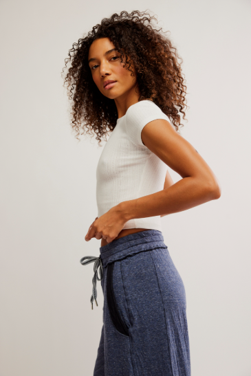 Free People Wait a Minute Baby Tee with a cropped, fitted design, short sleeves, and a soft, stretchy fabric, Oatmeal