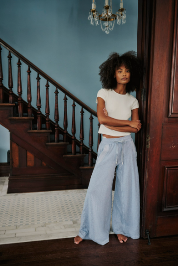 Free People Wait a Minute Baby Tee with a cropped, fitted design, short sleeves, and a soft, stretchy fabric, Oatmeal