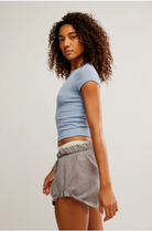 Free People Wait a Minute Baby Tee with a cropped, fitted design, short sleeves, and a soft, stretchy fabric, Soft Chambray