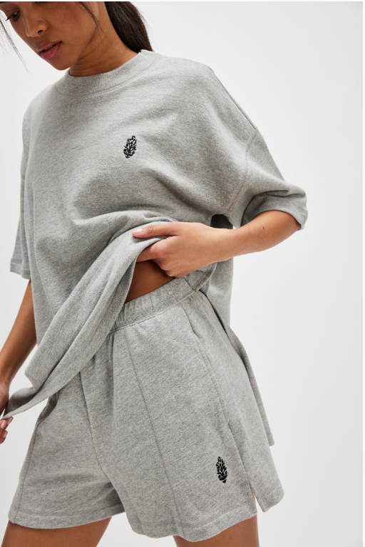 Free People Back Me Up Set – A relaxed, breathable two-piece set featuring a tunic-style top with side seam slits and a crew neckline, paired with high-rise shorts with side pockets and a dropped inseam, Heather Grey