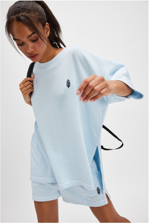 Free People Back Me Up Set – A relaxed, breathable two-piece set featuring a tunic-style top with side seam slits and a crew neckline, paired with high-rise shorts with side pockets and a dropped inseam, Baseline Blue