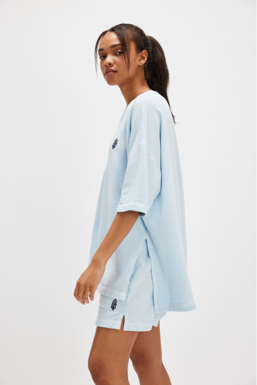 Free People Back Me Up Set – A relaxed, breathable two-piece set featuring a tunic-style top with side seam slits and a crew neckline, paired with high-rise shorts with side pockets and a dropped inseam, Baseline Blue