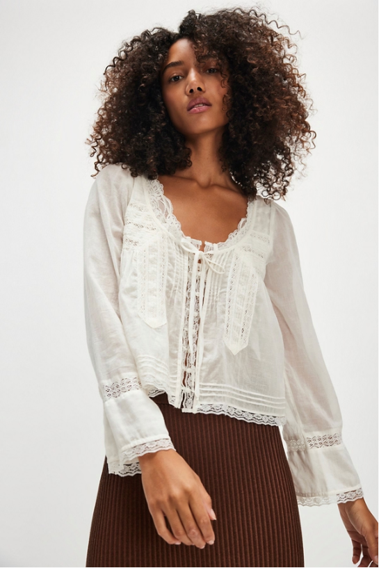 Free People Long Sleeve Forevermore Top – a relaxed, slightly cropped long-sleeve top with a square neckline, tie detail, button closures, and sheer lace trim, Ivory