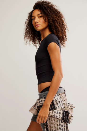 Free People Wait a Minute Baby Tee with a cropped, fitted design, short sleeves, and a soft, stretchy fabric, Black