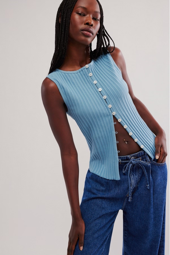 Free People Tilly Vest made from a soft, textured fabric with a relaxed, sleeveless design. This button-front vest offers a stylish and lightweight layering piece, perfect for adding a chic touch to any outfit, Ocean View