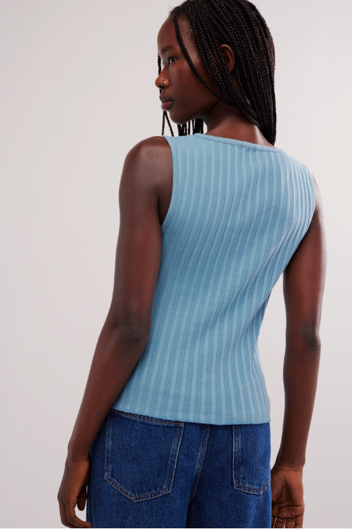 Free People Tilly Vest made from a soft, textured fabric with a relaxed, sleeveless design. This button-front vest offers a stylish and lightweight layering piece, perfect for adding a chic touch to any outfit, Ocean View