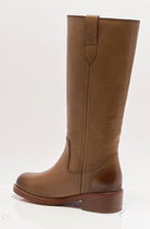Free People Blaze Pull-On Boots featuring a tall silhouette, square toe, and stacked leather heel with distressed details, Toast Leather