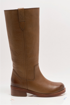 Free People Blaze Pull-On Boots featuring a tall silhouette, square toe, and stacked leather heel with distressed details, Toast Leather