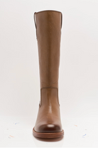 Free People Blaze Pull-On Boots featuring a tall silhouette, square toe, and stacked leather heel with distressed details, Toast Leather