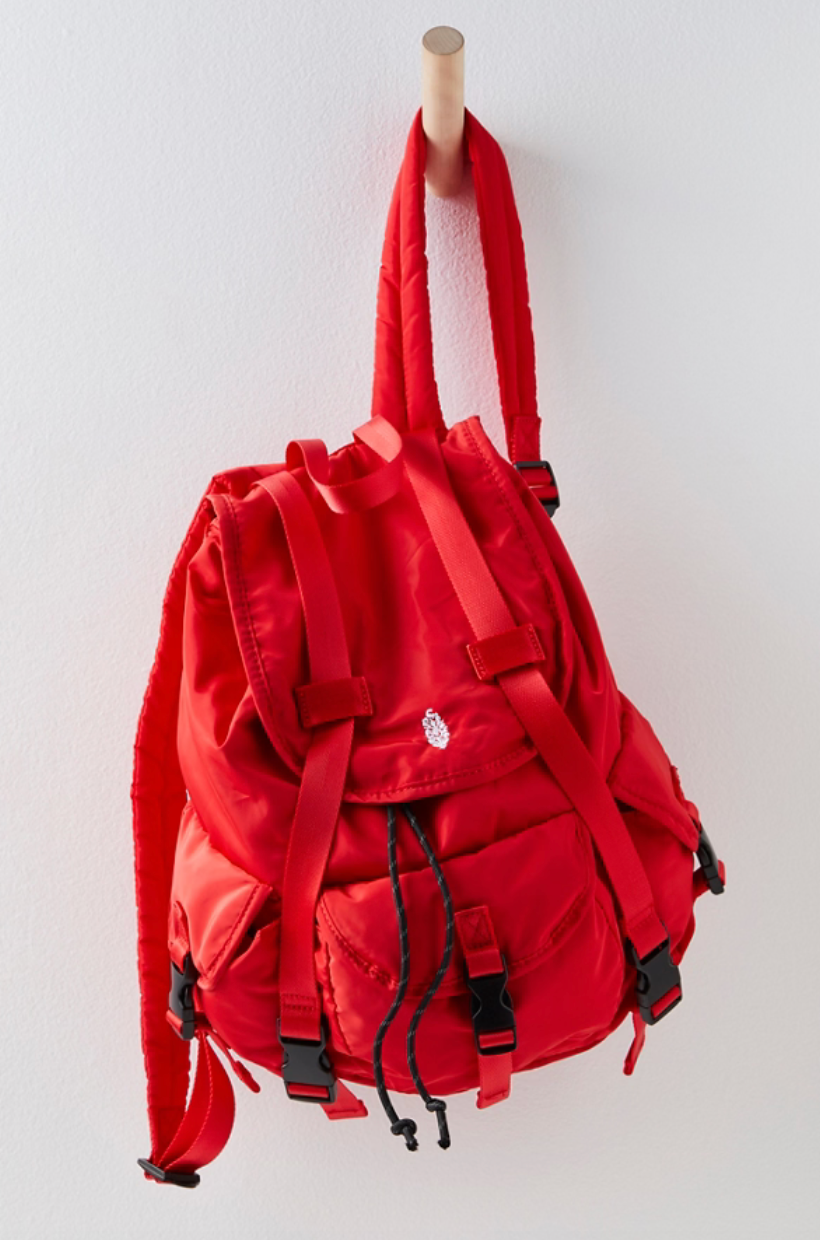 Free People The Adventure Pack – a functional, lightweight backpack with multiple zip compartments, adjustable straps, and a compact design perfect for on-the-go, Red