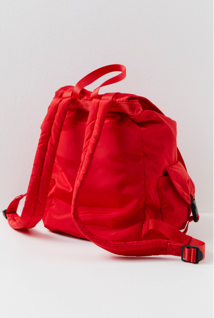 Free People The Adventure Pack – a functional, lightweight backpack with multiple zip compartments, adjustable straps, and a compact design perfect for on-the-go, Red