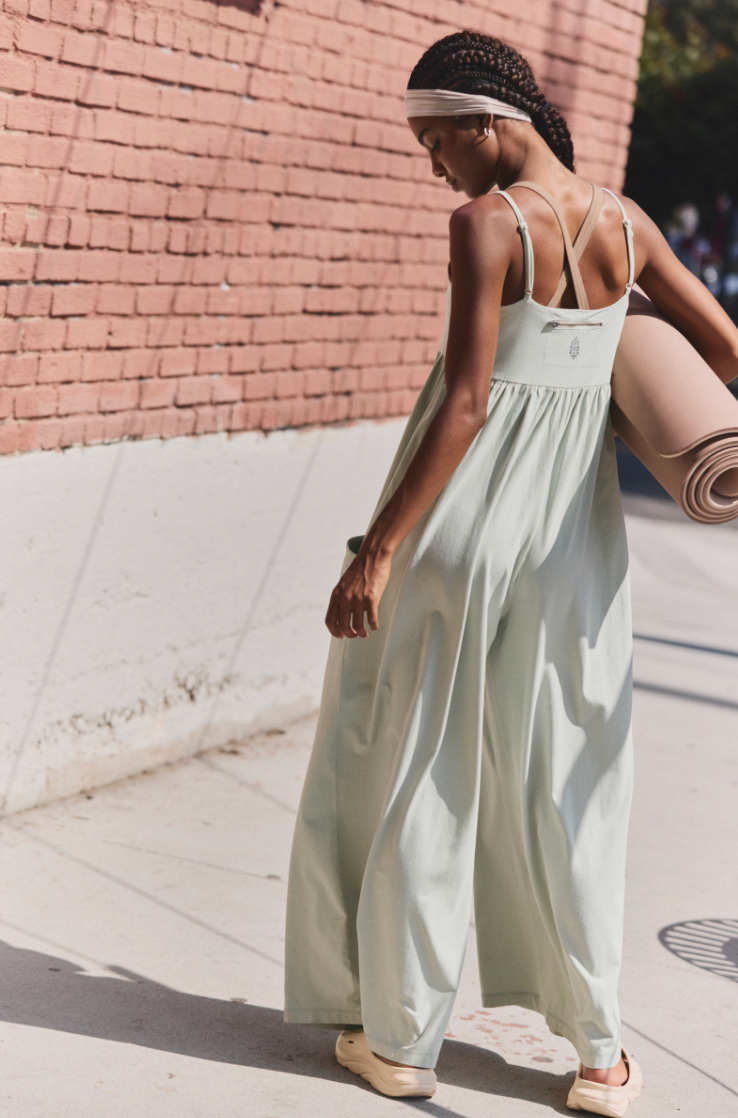 Free People Hot Shot Strappy Onesie, featuring soft cotton-blend fabric, simple shoulder straps, empire waist, and wide-leg slouchy fit, Green Tea