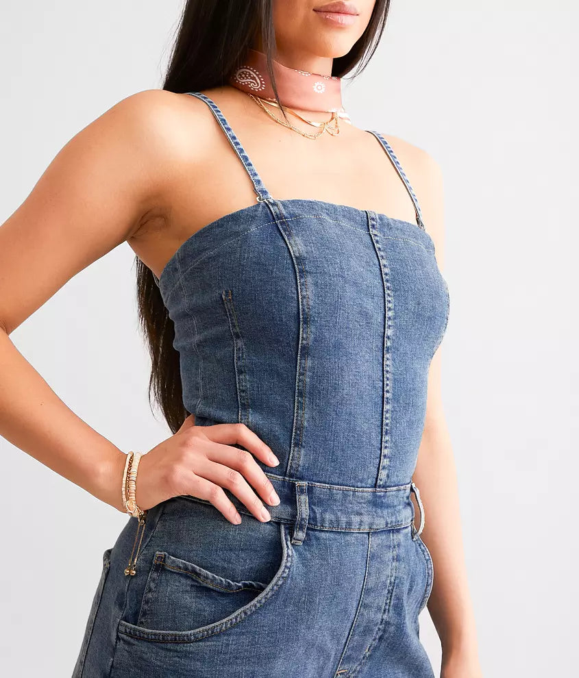 Free People Je Suis Prêt Denim Barrel Jumpsuit – a slim-fit jumpsuit with a corset-inspired bodice, tapered barrel leg, removable straps, five-pocket design, and smocking at the back, Petit Blue