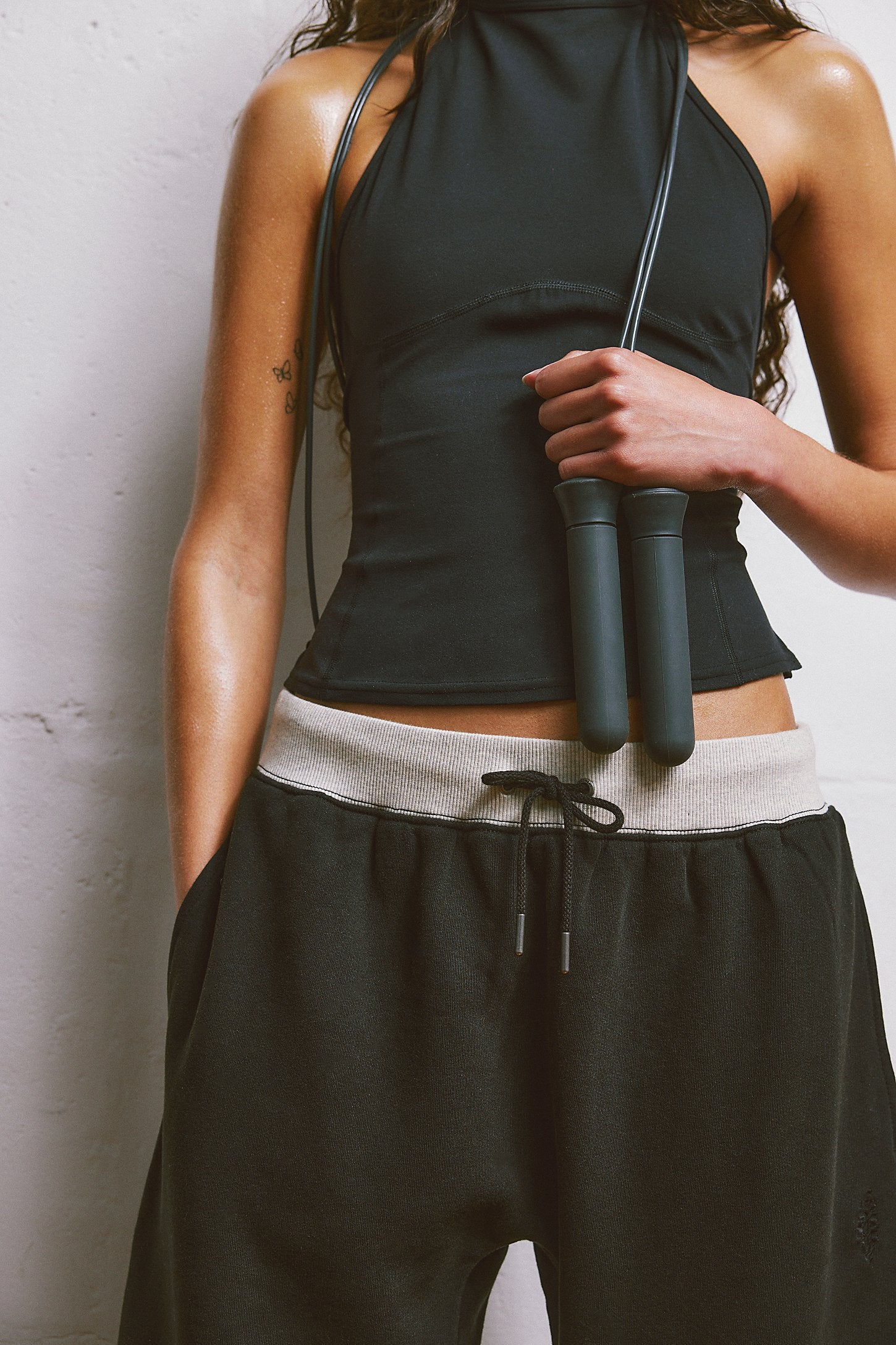 Free People You Wish Pant with a high-rise waist and unique barrel leg design, offering a comfortable and stylish look, Black