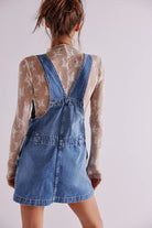 Free People Edie Denim Skirtall – a casual denim skirt with adjustable straps, front pockets, and a button-front design, Blue