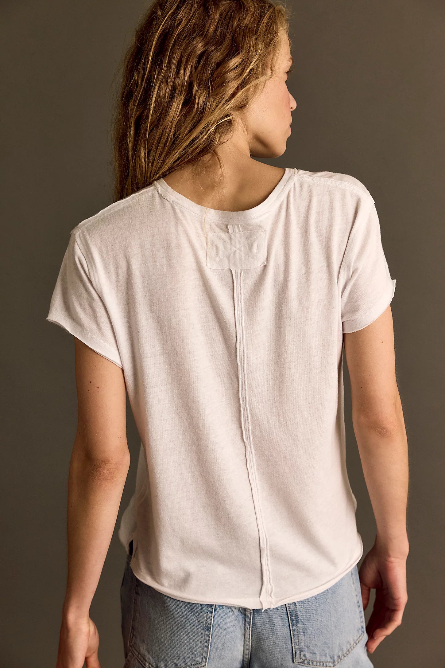 Free People Nova Tee – a relaxed-fit, short-sleeve cotton t-shirt with a raw hem and vintage-inspired faded wash, Ivory
