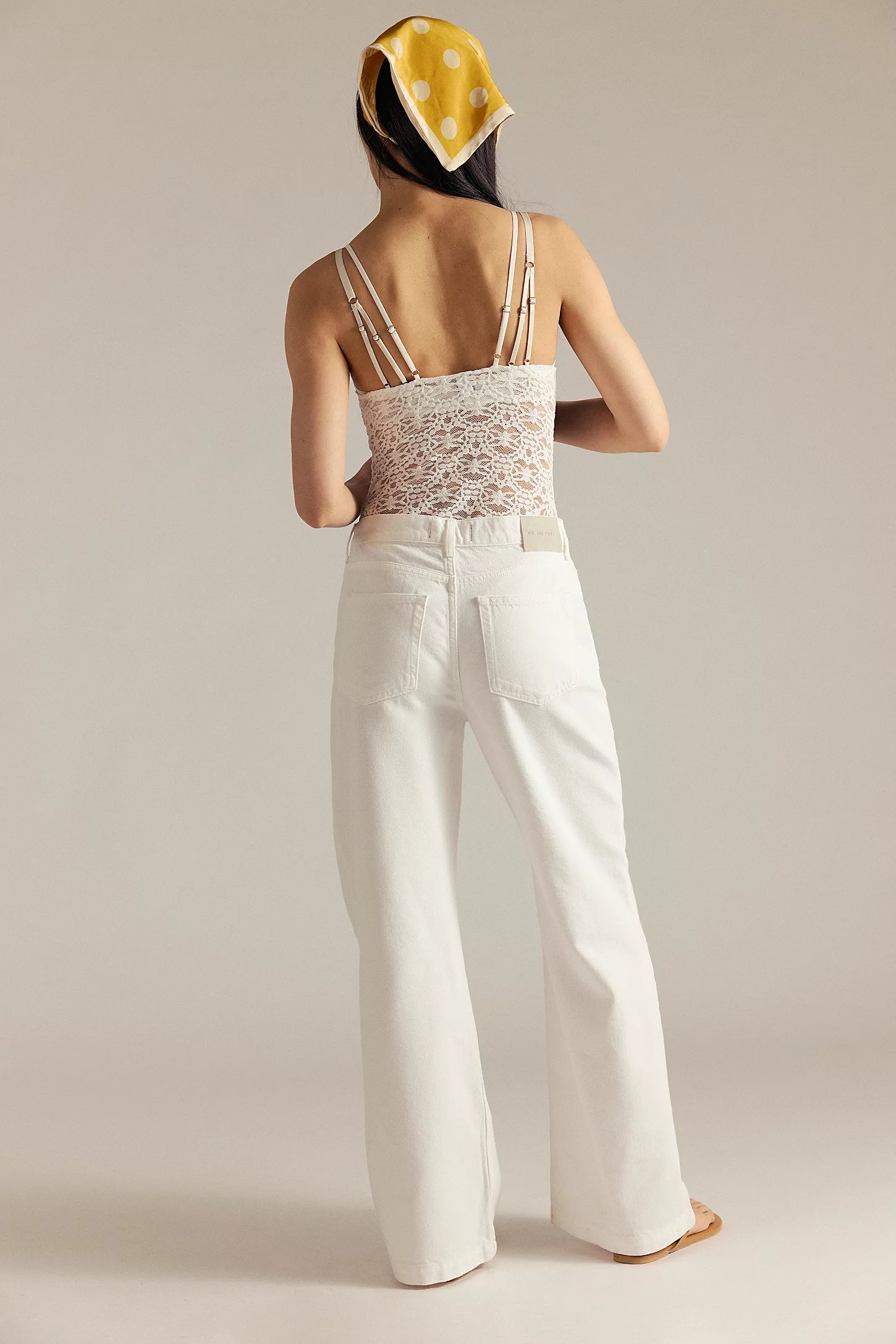 Free People Stride Straight N' Wide jeans, low-rise, wide-leg jeans in a soft, drapey denim. The jeans have a relaxed fit with a zip fly, button closure, and classic five-pocket styling. Styled with a tucked-in top and ankle boots, the look is casual yet effortlessly chic, Optic White