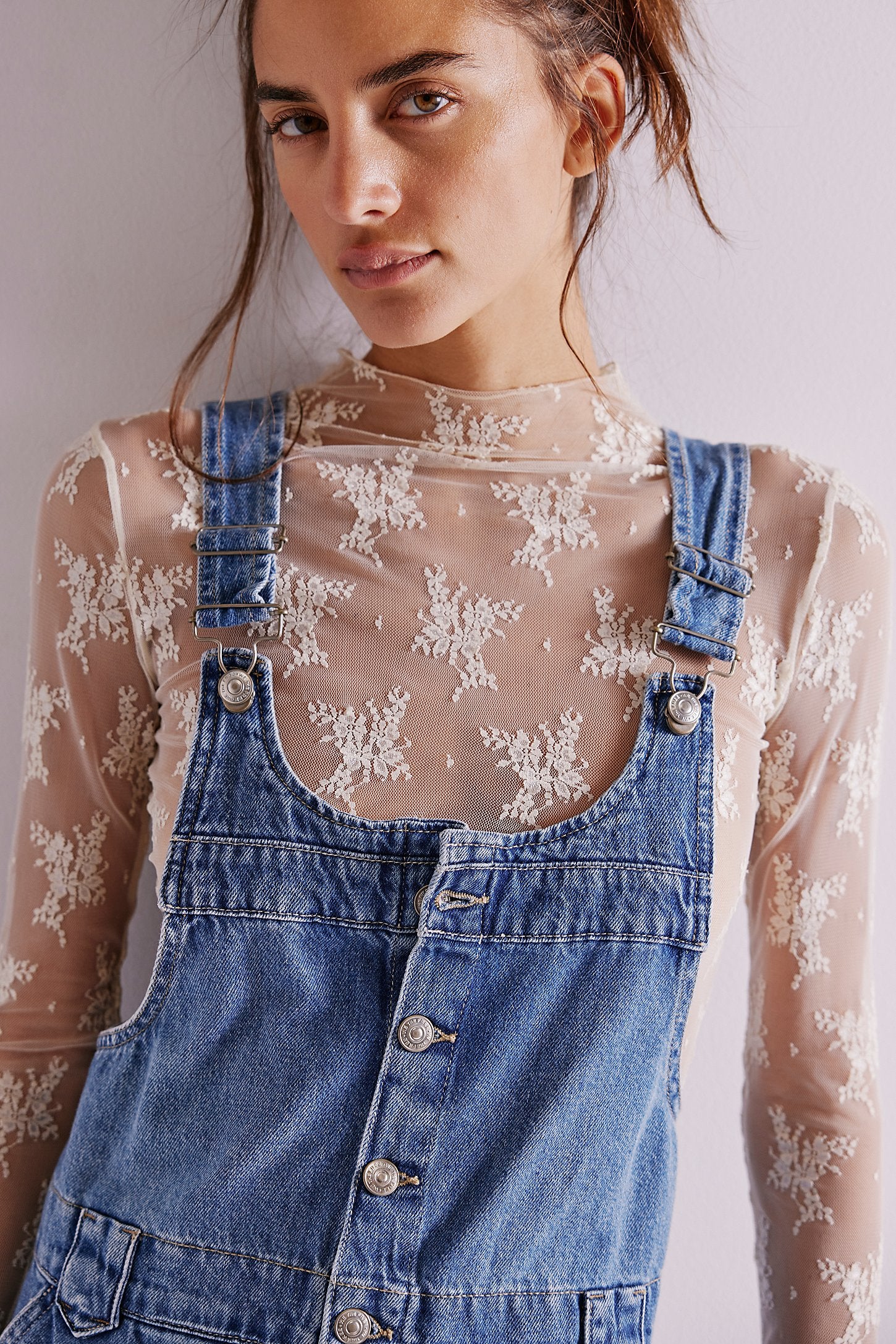 Free People Edie Denim Skirtall – a casual denim skirt with adjustable straps, front pockets, and a button-front design, Blue