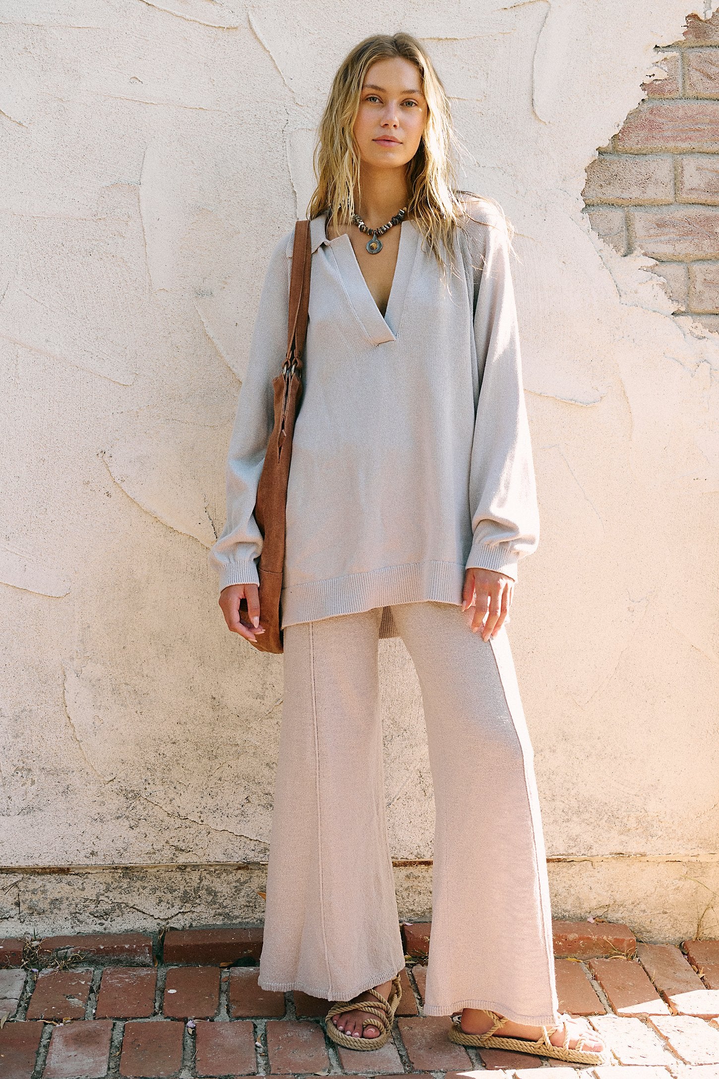 Free People Drea Sweater Set in a cozy knit fabric, featuring a relaxed-fit long-sleeve sweater and matching wide-leg pants, styled for a casual, comfortable look, Quiet Grey