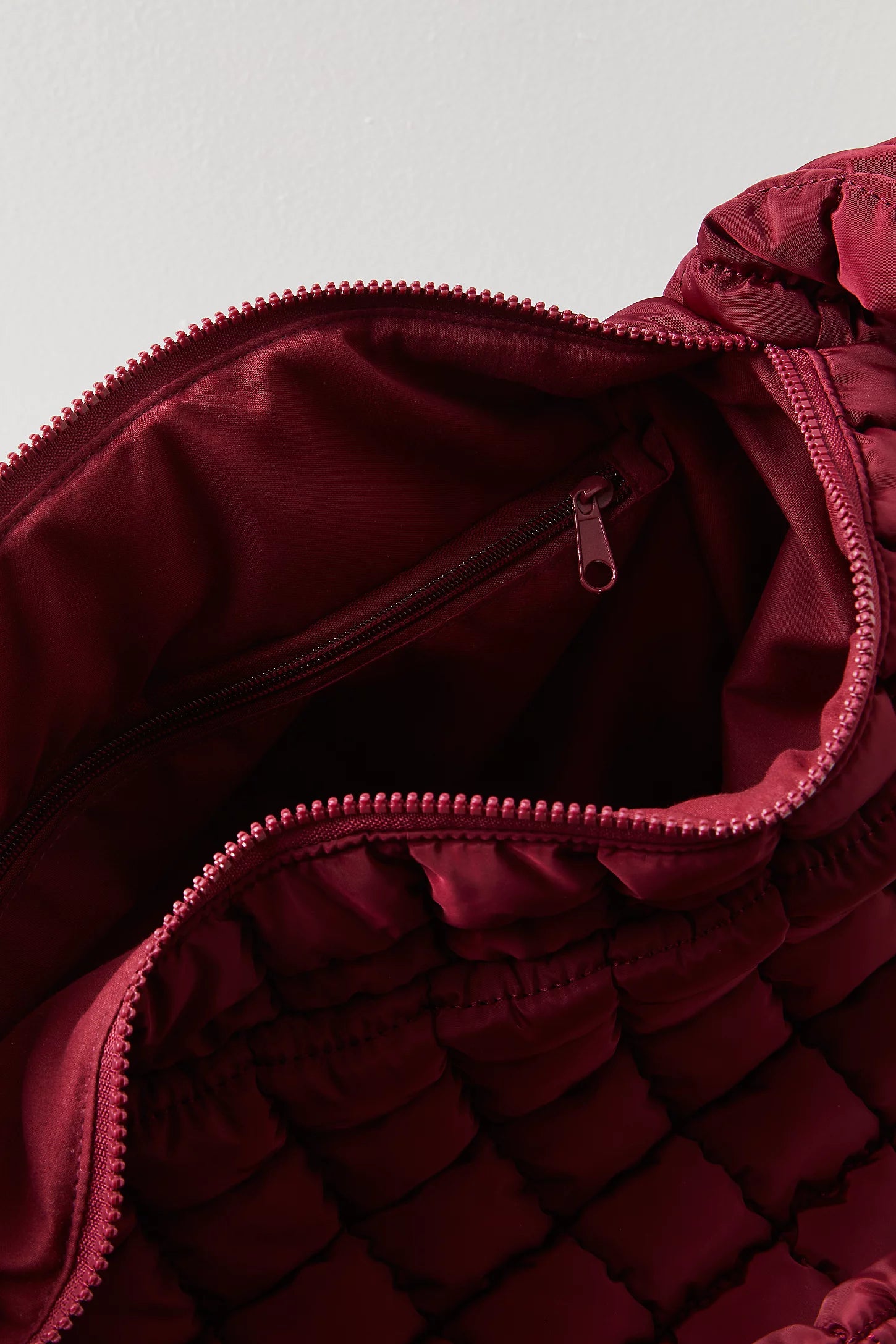 Free People Movement quilted carryall bag, oversized tote with padded texture, spacious interior, and casual sporty style, Deep Mullbery