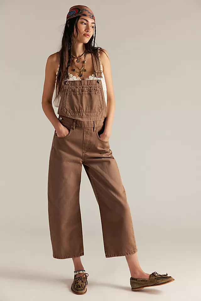 Free People Deep Trance Overalls in relaxed fit with wide-leg silhouette, boho-inspired design, and adjustable straps, Brown Sugar