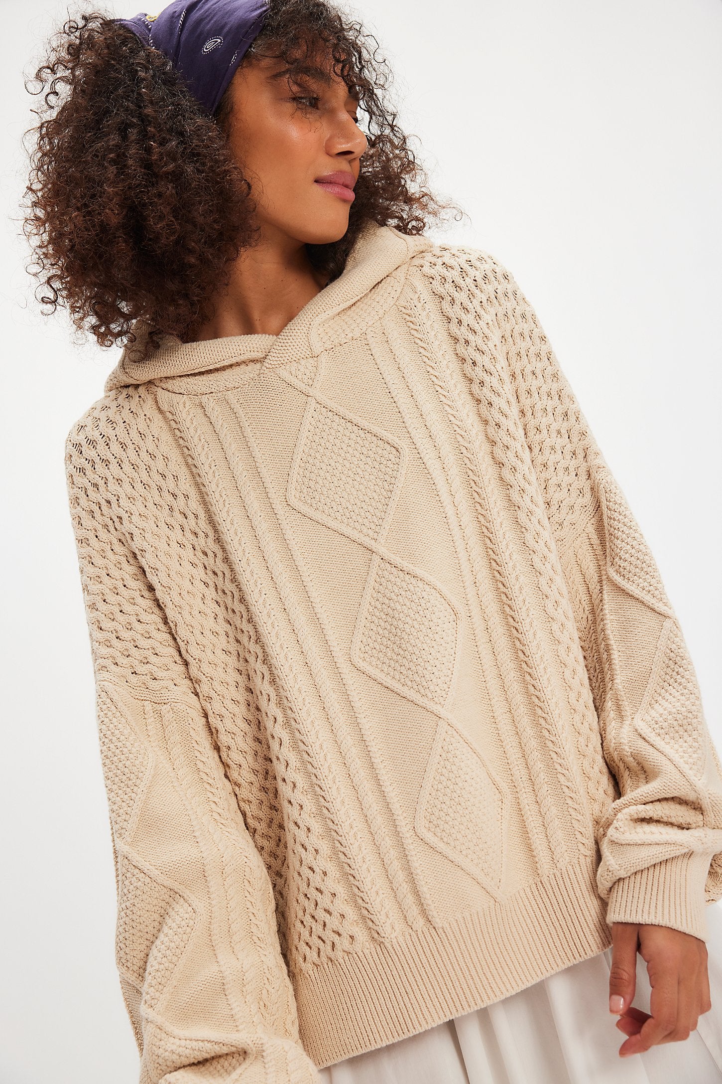 Free People Explorer Cable Hoodie featuring chunky cable knit texture, slouchy oversized fit, and cozy hood, Macadamia