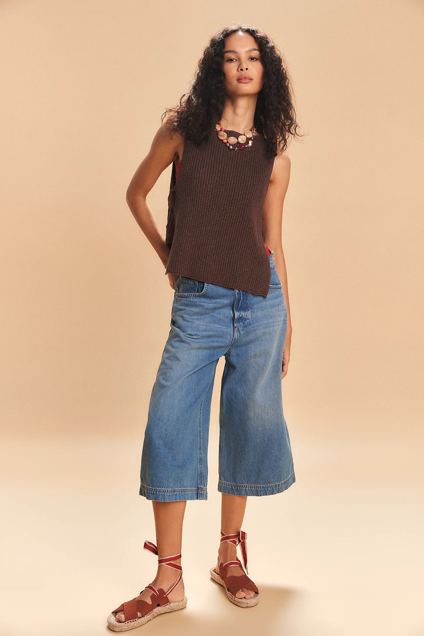 Free-est Lizzie Sweater Top — a relaxed, cropped knit top featuring a scoop neckline, ribbed texture, dropped armholes, and side tie closures for an airy, laid-back silhouette with a touch of playful detail, Carafe