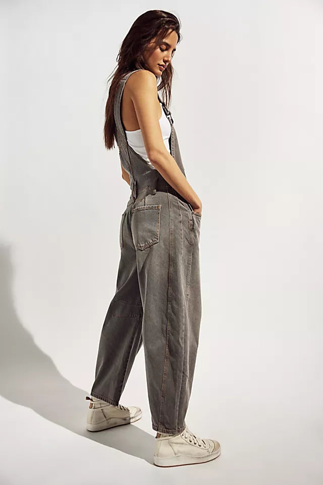 We The Free Good Luck Barrel Overalls with a relaxed, loose-fit design and wide-leg silhouette. These overalls feature adjustable straps and a soft, distressed denim fabric, offering a casual, boho-inspired look with a comfortable, laid-back feel, Archive Grey
