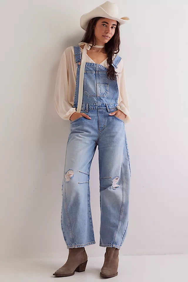 We The Free Good Luck Barrel Overalls with a relaxed, loose-fit design and wide-leg silhouette. These overalls feature adjustable straps and a soft, distressed denim fabric, offering a casual, boho-inspired look with a comfortable, laid-back feel, Going Steady