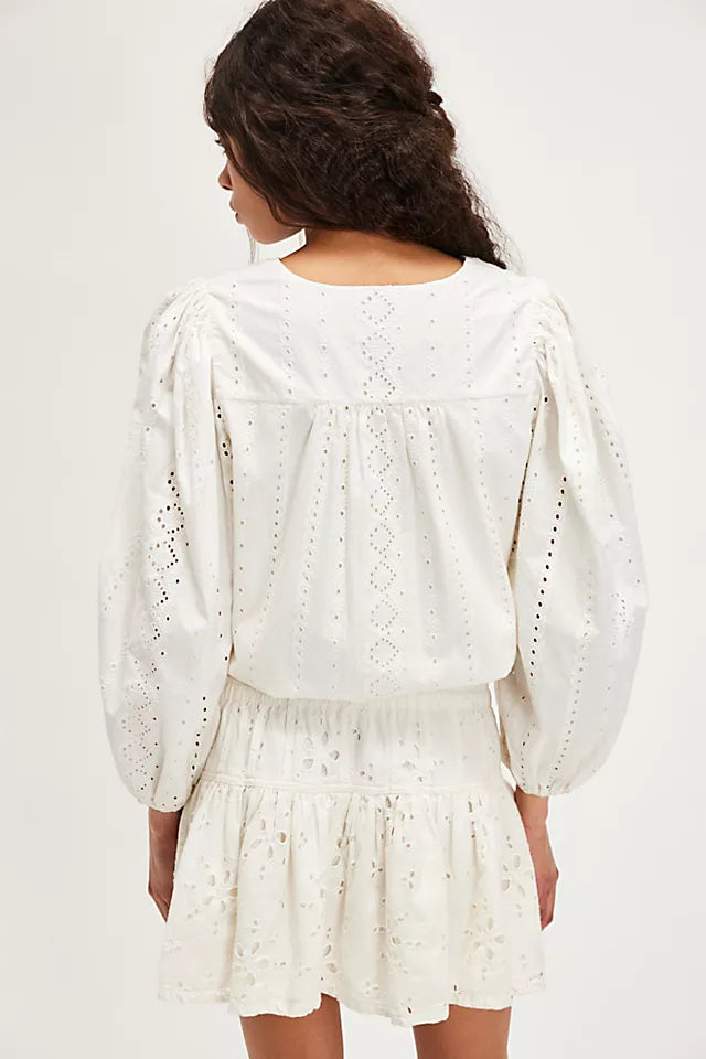 Free People Roselle Eyelet Mini Skirt – A feminine mini skirt featuring delicate eyelet detailing, a high waist, and a flattering, A-line silhouette for a light and breezy look, Ivory
