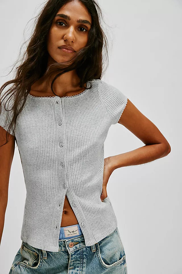 Free People Most Wanted Cardi with a form-fitting ribbed fabric, short capped sleeves, and buttons down the front, Light Heather