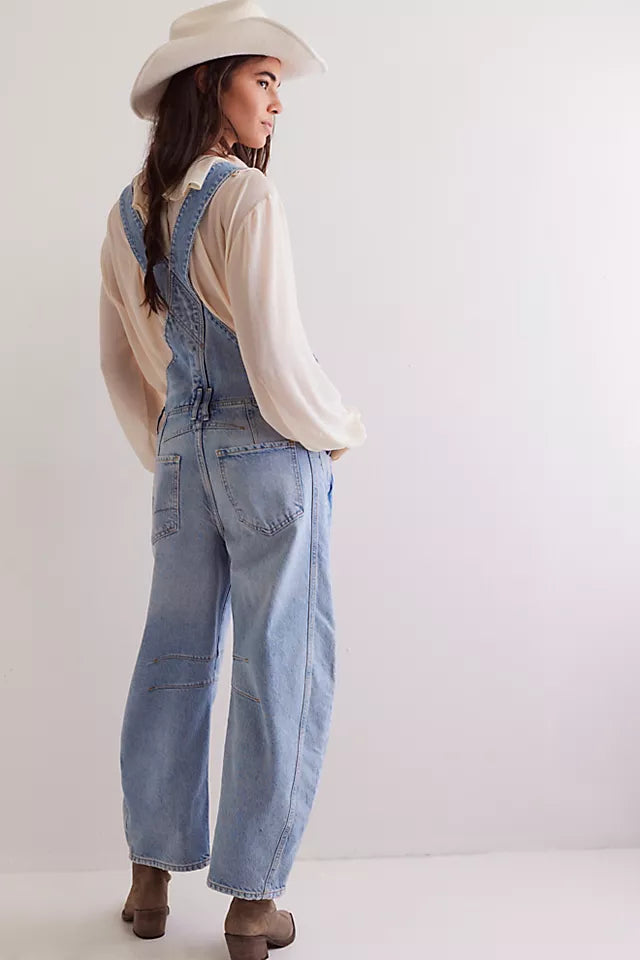 We The Free Good Luck Barrel Overalls with a relaxed, loose-fit design and wide-leg silhouette. These overalls feature adjustable straps and a soft, distressed denim fabric, offering a casual, boho-inspired look with a comfortable, laid-back feel, Going steady