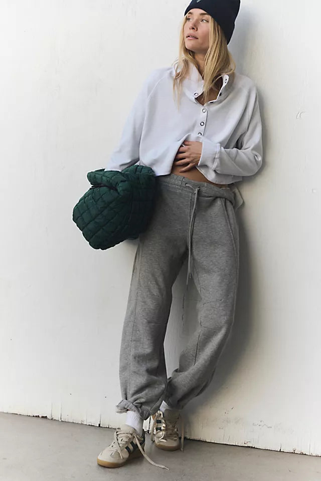 Free People Sprint to the Finish Pant featuring a mid-rise waist, relaxed fit through the hips and thighs, and a tapered leg for a modern, casual look, Heather Grey