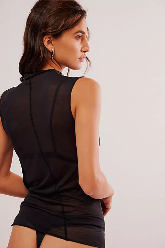 Free People On Air Muscle Tank with a mock neckline, ruched sides, and semi-sheer featherweight fabric in a drapey, form-fitting silhouette, Black