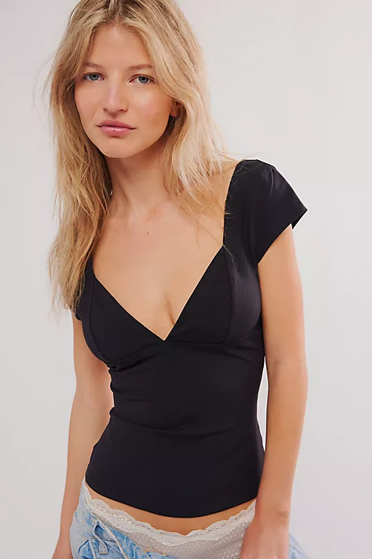 Free People Duo Corset Cami with a sweetheart neckline, capped sleeves, seamed cup design, and sculpting Duo fabric featuring a compressive mesh underlayer, Black