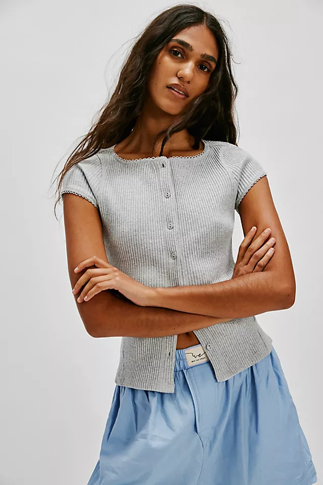 Free People Most Wanted Cardi with a form-fitting ribbed fabric, short capped sleeves, and buttons down the front, Light Heather
