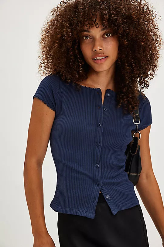 Free People Most Wanted Cardi with a form-fitting ribbed fabric, short capped sleeves, and buttons down the front, Navy