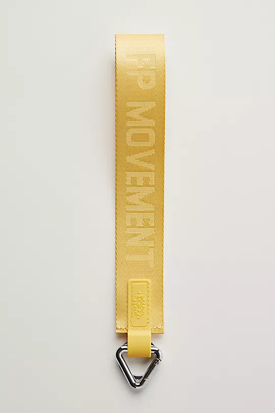 Free People There It Is Keychain – A sporty and versatile keychain with the FP Movement logo at the center, Dijon