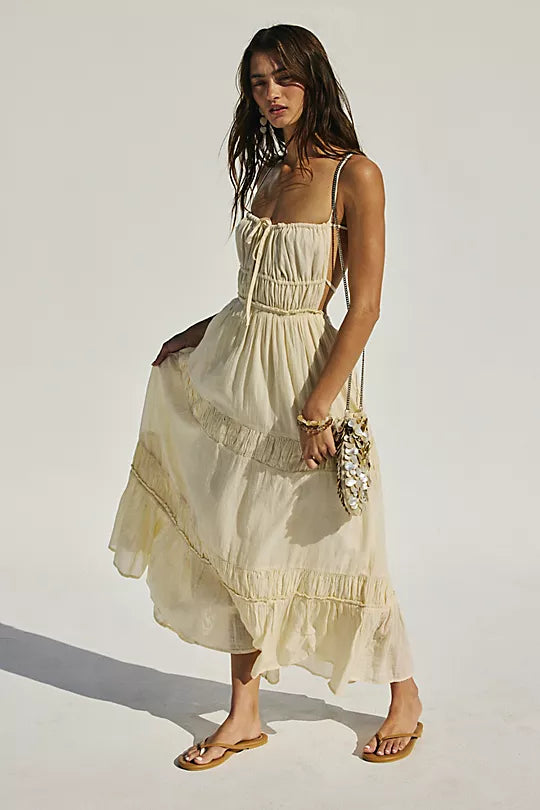 Free People Taking Sides Maxi Dress – a billowy, tiered maxi dress with a smocked bodice, front tie detail, open back, and adjustable tie-back straps, Wet Plaster